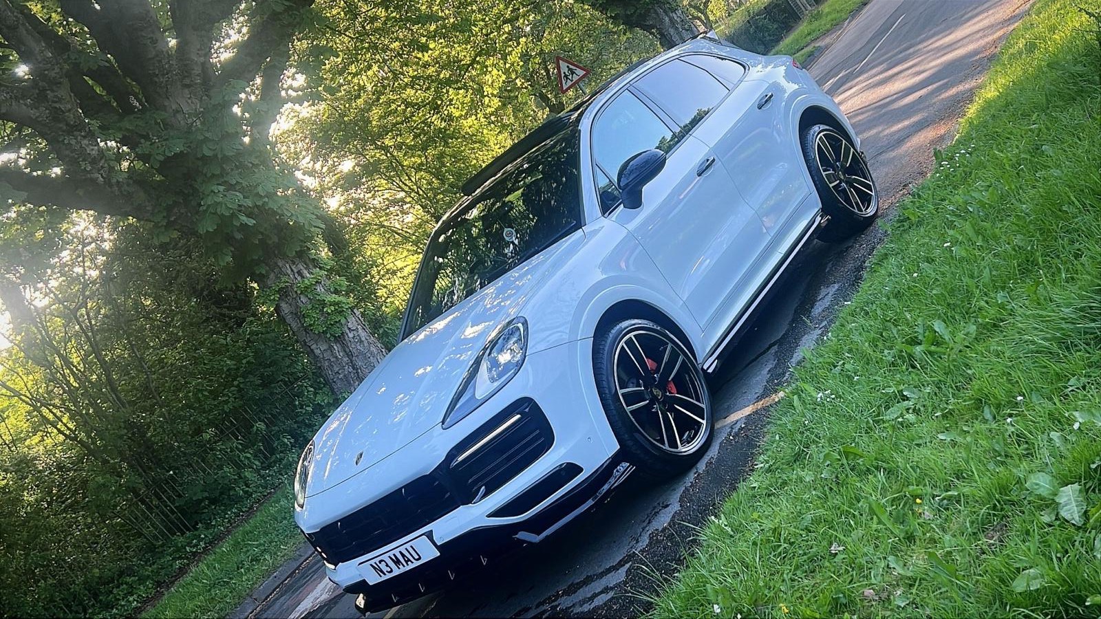 A white Porsche Cayenne with a showroom finish after a full valet by DR Elite